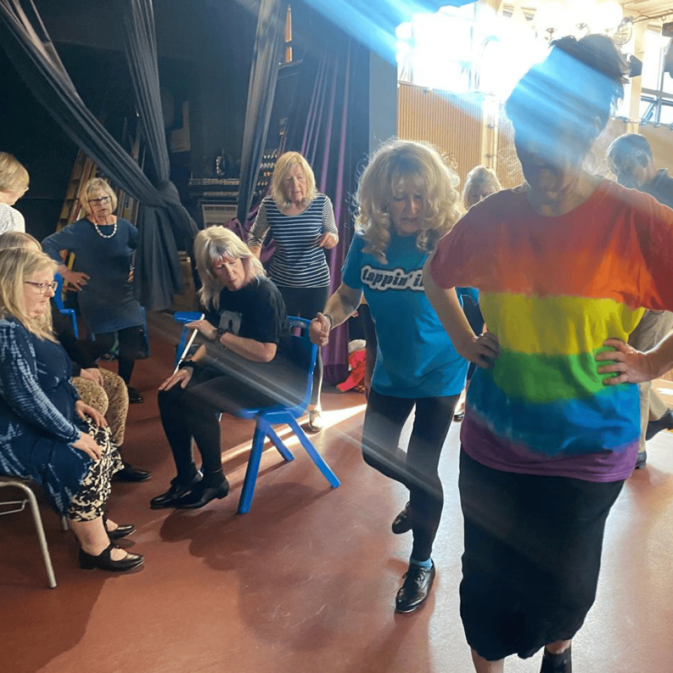 A Group Of Dancers Indoors
