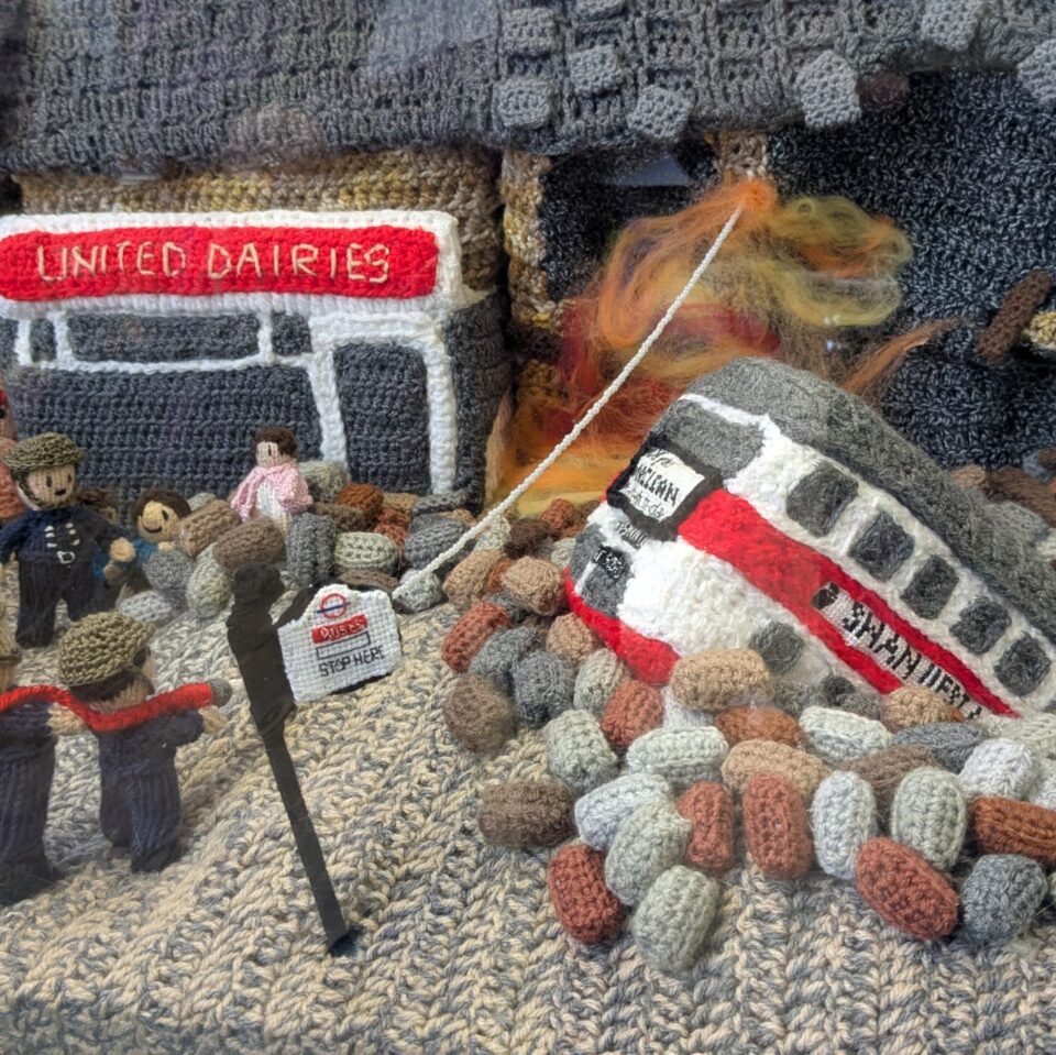 A Knitted Scene Showing A Bus Crash