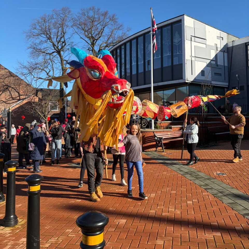 A Dragon Puppet Outside A Town Hall